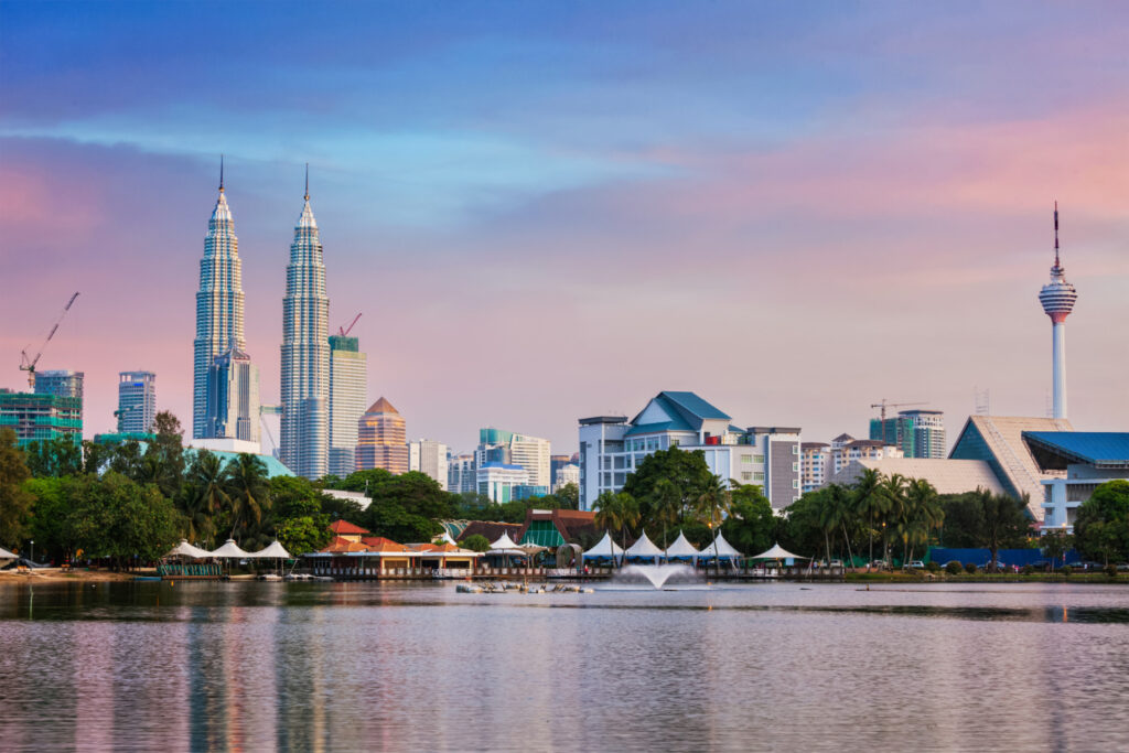 Petronas Towers illuminated at dusk, Kuala Lumpur, Malaysia — visa-free travel guide for Indians 2026