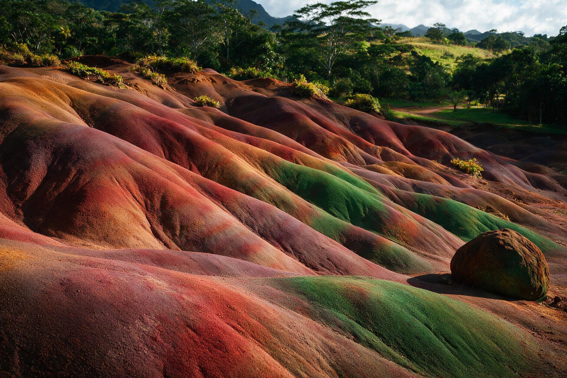 Seven Coloured Earths sand dunes at Chamarel, Mauritius, in bands of red, brown and purple
