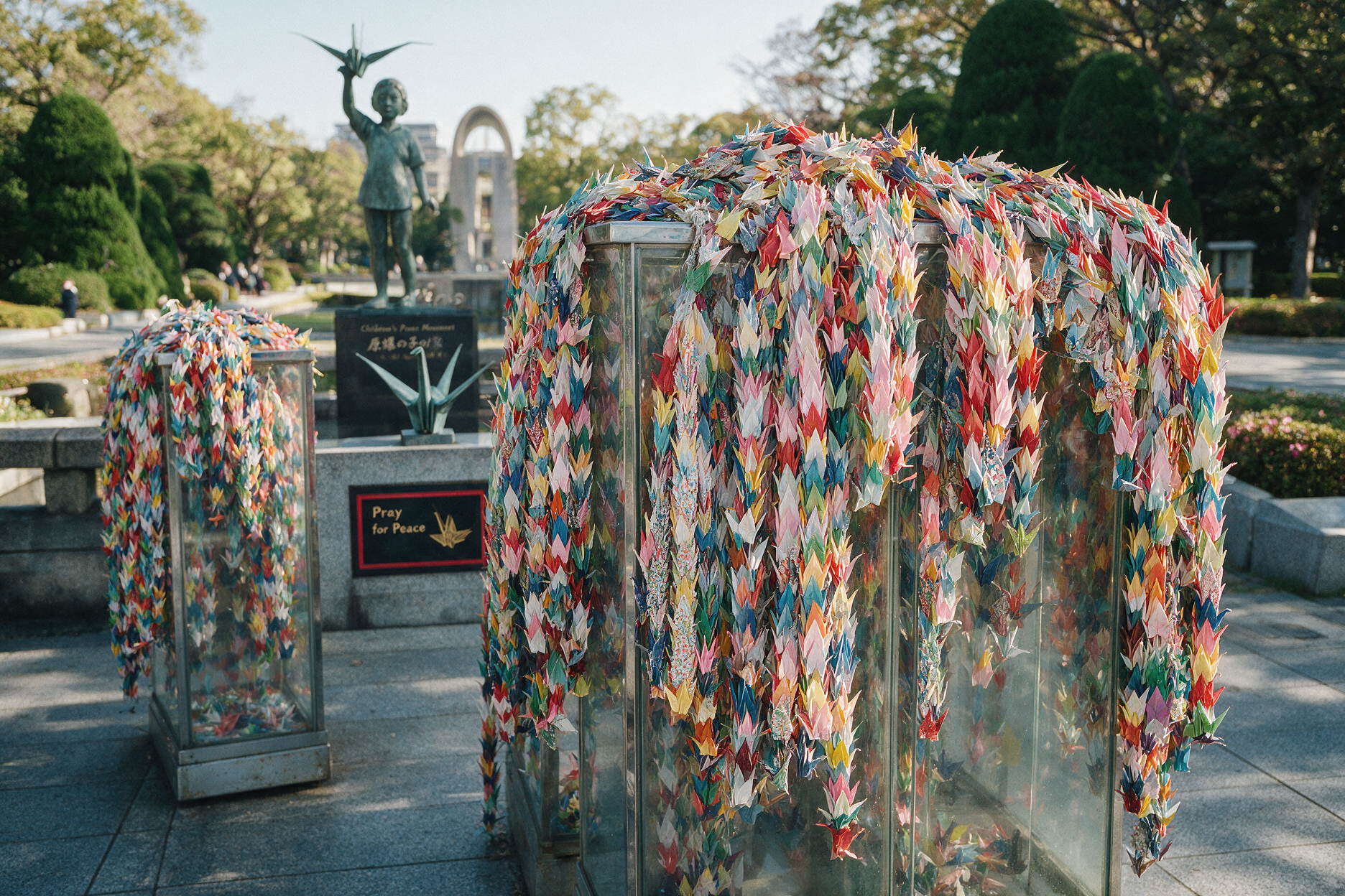 Thousands of colorful folded paper cranes displayed near the Children's Peace Monument in Hiroshima Peace Memorial Park