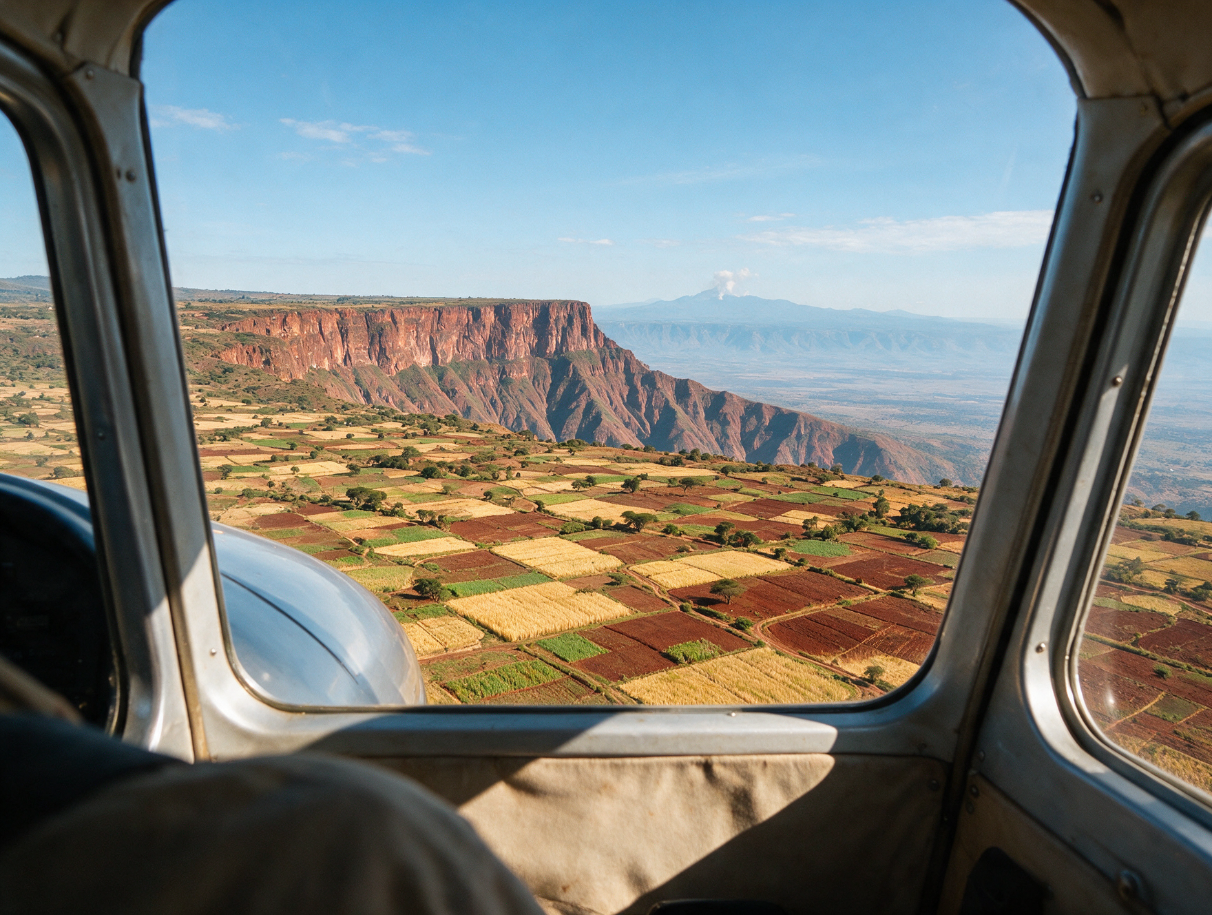 View of the Great Rift Valley from inside a small safari aircraft window