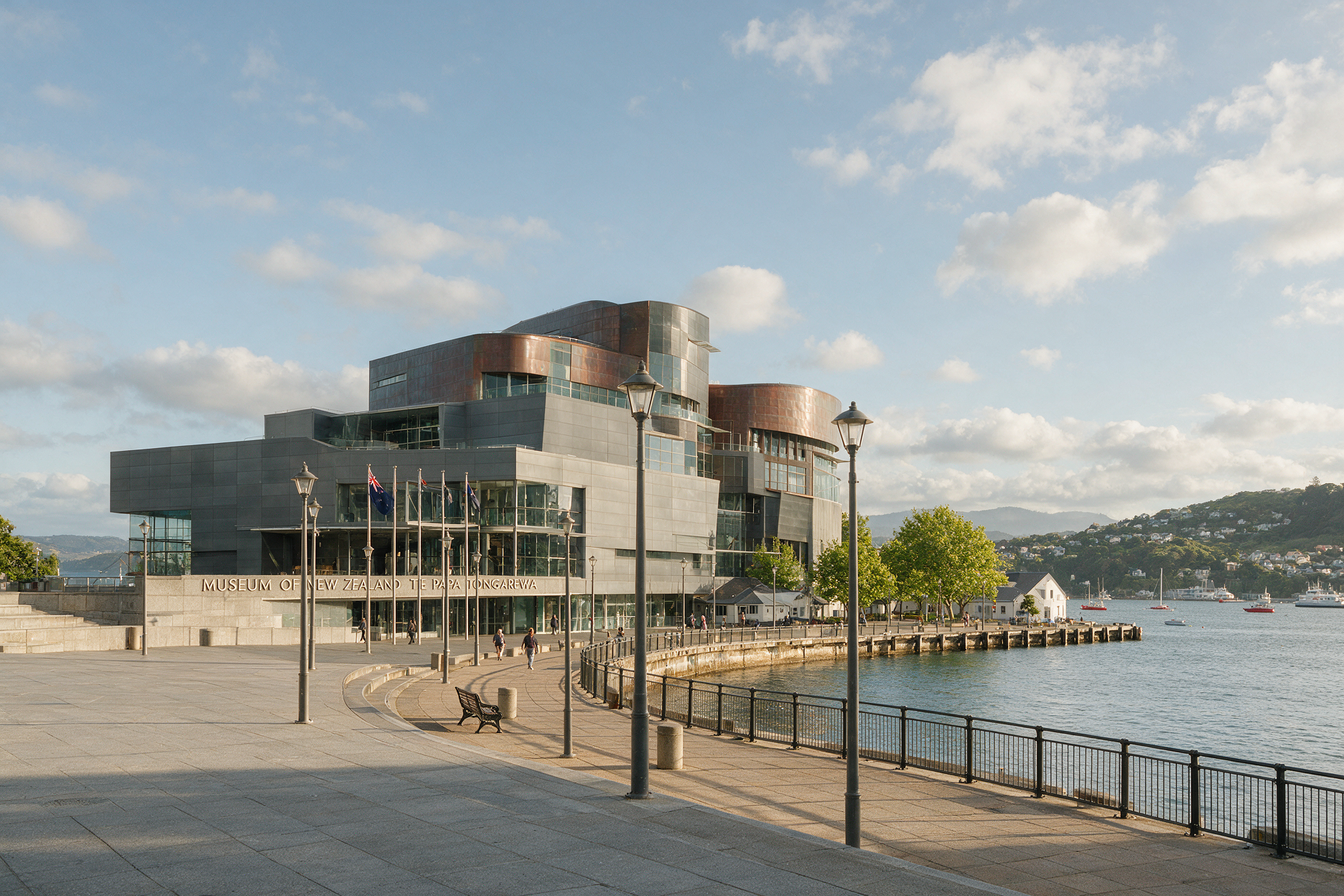 Te Papa Museum exterior on the Wellington waterfront with people walking